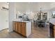Modern kitchen with light wood cabinets, granite countertops, and island at 16935 Buffalo Valley Path, Monument, CO 80132