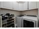 Laundry room with washer, dryer, and ample storage at 16935 Buffalo Valley Path, Monument, CO 80132