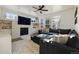 Spacious living room with a stone fireplace and sectional sofa at 16935 Buffalo Valley Path, Monument, CO 80132