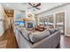 Inviting living room featuring a stone fireplace, large windows, and comfortable seating that create a warm atmosphere at 98 Leap Year Trl, Breckenridge, CO 80424