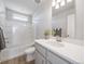 Bright bathroom featuring a shower-tub combination, and a vanity with neutral finishes at 22033 E 38Th Pl, Aurora, CO 80019