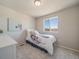Cozy bedroom with carpet flooring, a double window, and neutral wall color at 22033 E 38Th Pl, Aurora, CO 80019