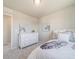 Comfortable bedroom with carpet, zebra wall art, and large window for natural light at 22033 E 38Th Pl, Aurora, CO 80019