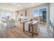 Cozy dining area adjacent to kitchen features modern finishes and a large sliding glass door at 22033 E 38Th Pl, Aurora, CO 80019