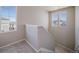 Bright hallway with carpeted floors and natural light from well-placed windows at 22033 E 38Th Pl, Aurora, CO 80019