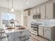 Stylish kitchen with quartz countertops, stainless steel appliances, and modern pendant lighting at 22033 E 38Th Pl, Aurora, CO 80019