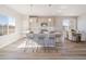 Open concept kitchen with a large island, bar seating, and bright natural light at 22033 E 38Th Pl, Aurora, CO 80019