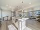 Bright, open-concept kitchen flowing into a cozy living space with abundant natural light at 22033 E 38Th Pl, Aurora, CO 80019