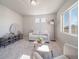 Cozy living room with large windows and modern furniture creating a relaxing space at 22033 E 38Th Pl, Aurora, CO 80019