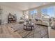 Inviting living room with large windows, stylish decor, and comfortable seating arrangement at 22033 E 38Th Pl, Aurora, CO 80019