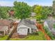 Aerial view showing the house, fenced yard, and surrounding neighborhood at 2212 Ingalls St, Edgewater, CO 80214