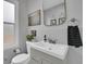 Well-lit bathroom with modern vanity, elegant fixtures, and tasteful decor at 2212 Ingalls St, Edgewater, CO 80214