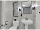 Modern bathroom with pedestal sink, sleek fixtures, and stylish decor at 2212 Ingalls St, Edgewater, CO 80214
