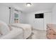 Bright bedroom with white bedding, ample closet space, and a cozy ambiance at 2212 Ingalls St, Edgewater, CO 80214