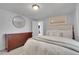 Relaxing bedroom featuring a dresser and comfortable bed at 2212 Ingalls St, Edgewater, CO 80214