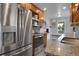 Modern kitchen boasts stainless steel appliances, granite countertops, and ample cabinet space at 2212 Ingalls St, Edgewater, CO 80214