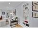 Bright living room boasts stylish furnishings, built-in bookshelves, and ample natural light for comfortable living at 2212 Ingalls St, Edgewater, CO 80214