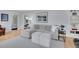 Well-lit living room showcasing hardwood floors and stylish interior design elements at 2212 Ingalls St, Edgewater, CO 80214
