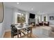 Stylish living room featuring hardwood floors and a stone fireplace at 2212 Ingalls St, Edgewater, CO 80214
