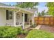 Charming outdoor patio with cozy seating, heater, and manicured landscaping at 2212 Ingalls St, Edgewater, CO 80214