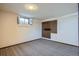 Unfinished basement area with pegboard wall and carpeted floor at 2206 Zinnia St, Golden, CO 80401