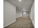 Spacious carpeted basement area with neutral tones and a window providing natural light at 5283 Union Ct # 8, Arvada, CO 80002
