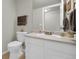 Cozy bathroom featuring a vanity with sink, toilet, and neutral wall color at 5283 Union Ct # 8, Arvada, CO 80002