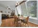 Well-lit dining area with large windows, hardwood floors, and an open layout connecting to the living room at 5283 Union Ct # 8, Arvada, CO 80002