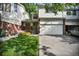 Inviting exterior with a well-maintained lawn, attached garage, and classic brick and siding facade at 5283 Union Ct # 8, Arvada, CO 80002