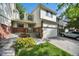 Charming exterior with a well-maintained lawn, attached garage, and classic brick and siding facade at 5283 Union Ct # 8, Arvada, CO 80002