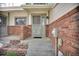 Cozy porch with brick accents and detailed doorway creating a welcoming entrance at 5283 Union Ct # 8, Arvada, CO 80002