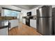 Bright kitchen features stainless steel appliances, granite countertops, and a window letting in natural light at 5283 Union Ct # 8, Arvada, CO 80002