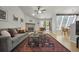 Bright living room featuring a fireplace, comfortable seating, and an adjacent dining area at 5283 Union Ct # 8, Arvada, CO 80002