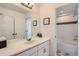 Bathroom with vanity, sink and a door to the shower and tub combination at 154 Cortona Pl, Castle Pines, CO 80108