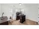 Well-lit bedroom with two desks, perfect for a home office or study space at 154 Cortona Pl, Castle Pines, CO 80108