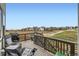Spacious deck with outdoor seating overlooking a new home construction community at 154 Cortona Pl, Castle Pines, CO 80108