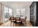 Bright dining room with sliding door access to deck, and contemporary furnishings at 154 Cortona Pl, Castle Pines, CO 80108
