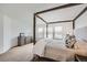 Comfortable main bedroom featuring a four-poster bed, soft lighting, and ample closet space at 154 Cortona Pl, Castle Pines, CO 80108