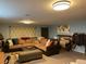 Finished basement with sectional sofa and large screen TV at 12505 N 3Rd St, Parker, CO 80134