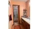 Bathroom with a vanity, shower, and linen shelving at 12505 N 3Rd St, Parker, CO 80134