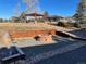 Brick fire pit with wooden retaining walls at 12505 N 3Rd St, Parker, CO 80134