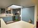 Bright kitchen featuring light blue cabinetry, ample counter space, and a window at 12505 N 3Rd St, Parker, CO 80134