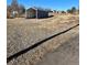 Gravel lot with covered storage structure at 12505 N 3Rd St, Parker, CO 80134