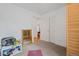 Spare bedroom with closet and door looking to the living room with wood floors at 8112 Gray Ct # 394, Arvada, CO 80003