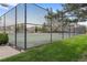 View of community tennis court surrounded by tall black chain-link fence at 8112 Gray Ct # 394, Arvada, CO 80003