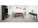 Finished basement featuring neutral carpet, a dining area, and a console table at 5401 E Dakota Ave # 3, Denver, CO 80246