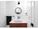 Modern bathroom features square sink, dark fixtures, and bright white walls at 5401 E Dakota Ave # 3, Denver, CO 80246