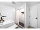 Contemporary bathroom boasts geometrically-textured walls, and a shower niche for storage at 5401 E Dakota Ave # 3, Denver, CO 80246