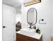 Modern bathroom features square sink, dark fixtures, and bright white walls at 5401 E Dakota Ave # 3, Denver, CO 80246