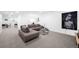 Spacious living room is complete with modern decor and neutral colored carpet at 5401 E Dakota Ave # 3, Denver, CO 80246